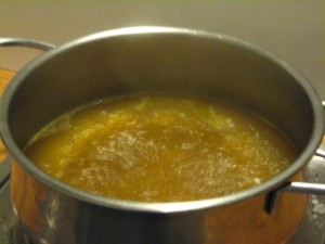 Bringing the broth to a boil.