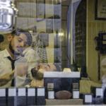 A view through the window of the barber shop in Monti