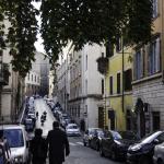 A couple walking down Via Panisperna