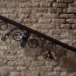 Locks attached to a metal railing at Salita dei Borgia