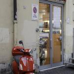 Vespa scooter in front of the scooter/bicycle rental agency